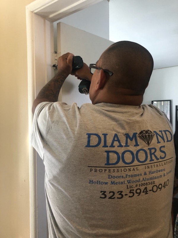 2. Expert Installation - Professional commercial door installation process by Diamond Doors Los Angeles