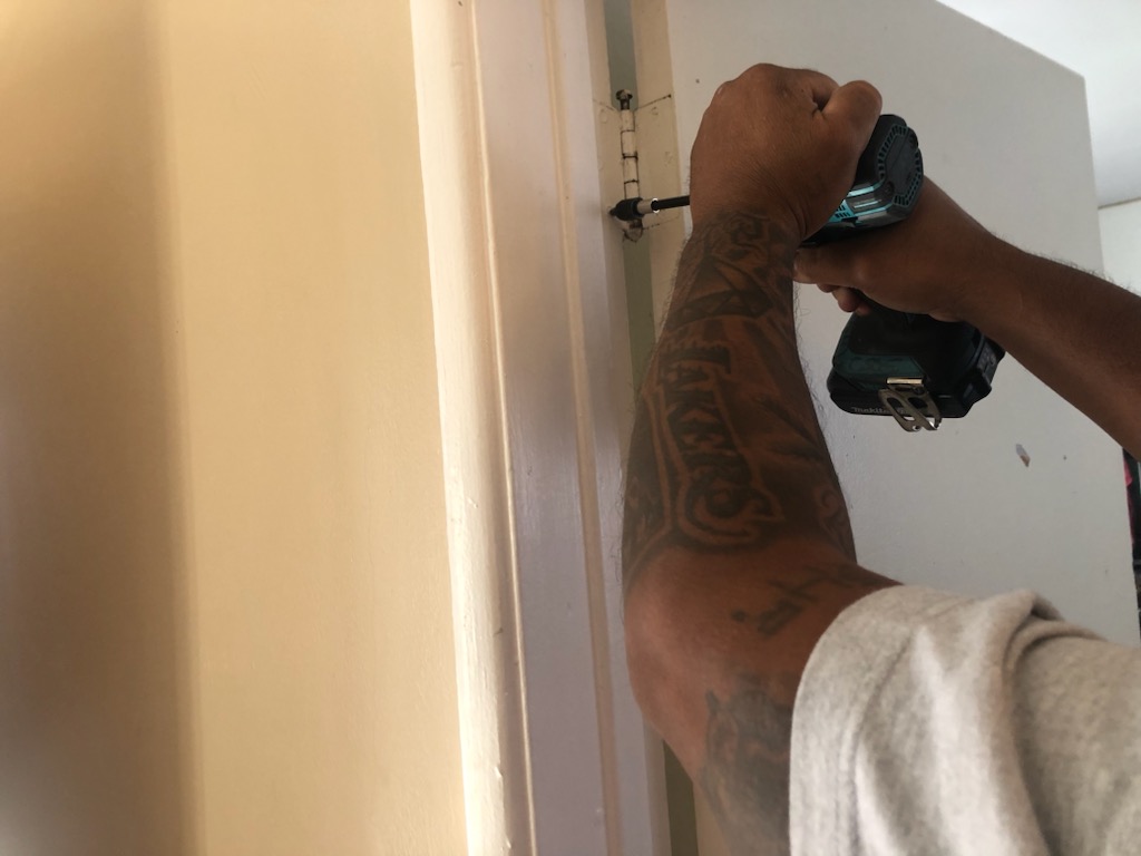 1. Professional Removal - Professional commercial door installation process by Diamond Doors Los Angeles